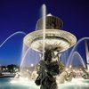 Scenic night view of one of the Fontaines de la Concorde at play