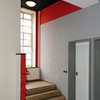 Student hostel, stair interior, showing tripartition of the ceiling colors in black and red with white walls