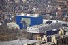 Aerial context view showing the blue titanium and glass south wing facade facing Grange Park and the OCAD building to the right