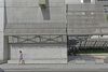 Detail, four story annex, street facing short walls with precast concrete panels, signage and metal sun shading