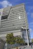 Detail, at the fourth story the steel panels begin a "folded" drape and begin to spill off building to create an overhang at ground floor