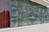 Entry wall, depicting mirrored Tinos verde antico marble