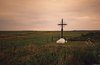 Acadian Memorial Cross at dusk