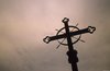 Acadian Memorial Cross at dusk, detail