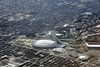 1976 Olympic Stadium (Stade Olympique) with the Botanical Gardens of Montréal (Jardins botaniques de Montréal) just above and left