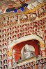 Carved and painted east wall, detail with many tiny Buddhas in niches