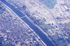Aerial view showing settlements on both side of the Nile (Thebes and the West Bank are left and suburbs of Luxor on right)