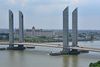 General view: Aerial view from the belvedere of La Cité du Vin, depicting the four independent pylon towers – one at each corner of the lift span –– and the River Garonne