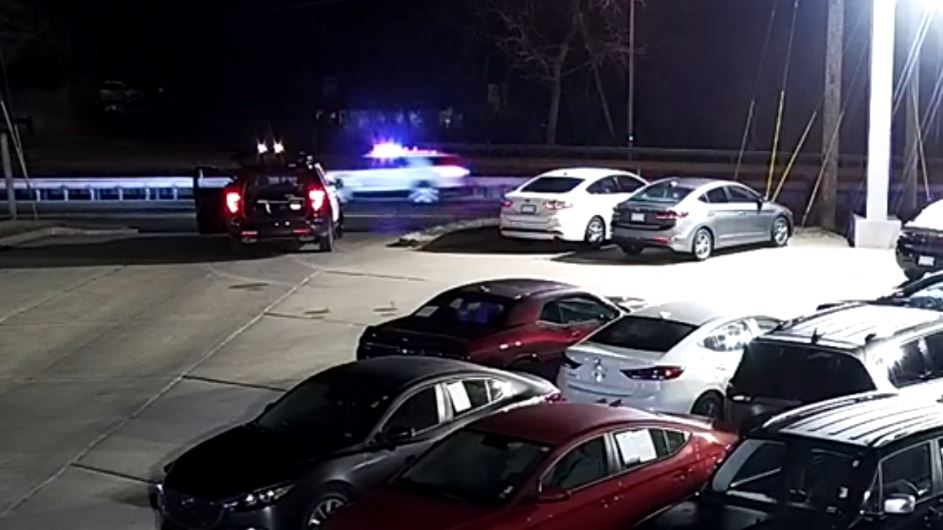 surveillance video of police chasing suspect