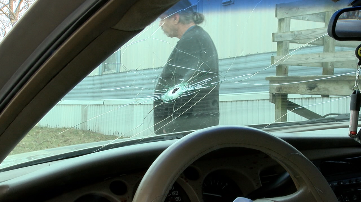 bullet hole in McCaulou car