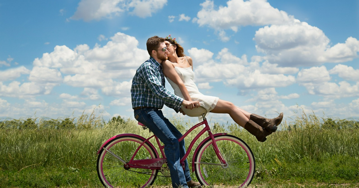 Romantic bicycle ride man and a woman