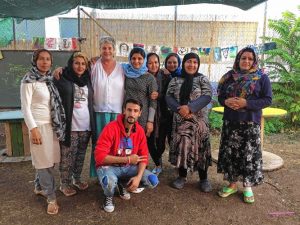 Sakellariou with some Afghani female students and her translator, as featured in Monadnock Ledger-Transcript