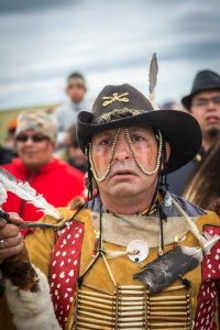 "Veteran's March at Standing Rock" Native American military veteran leads prayer march to sacred burial site, the scene of prior confrontation between protesters and Energy Transfer Partners private security. (Courtesy of Mark Manley)