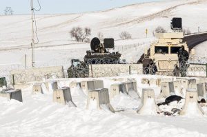 "Return to Standing Rock--A barricade across the Backwater bridge where water protectors were hosed with water in subfreezing temperatures a few weeks earlier. Near Standing Rock N.D. U.S.A." (Courtesy of Mark Manley)