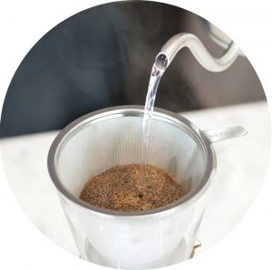 Grosche-Amsterdam-Pour-over-coffee-maker-with-water-being-poured-into-it-round