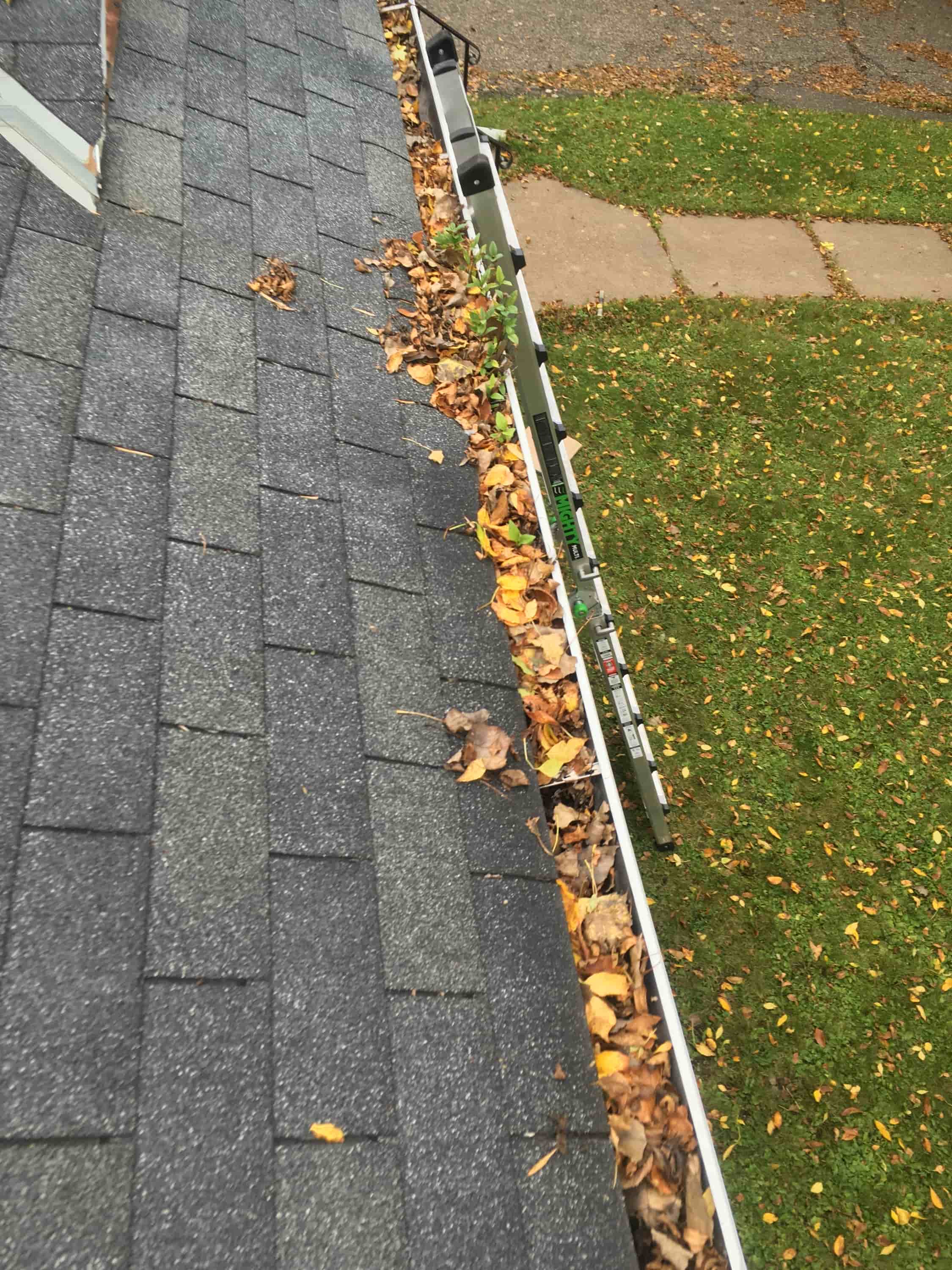 cleaning downspouts from ground