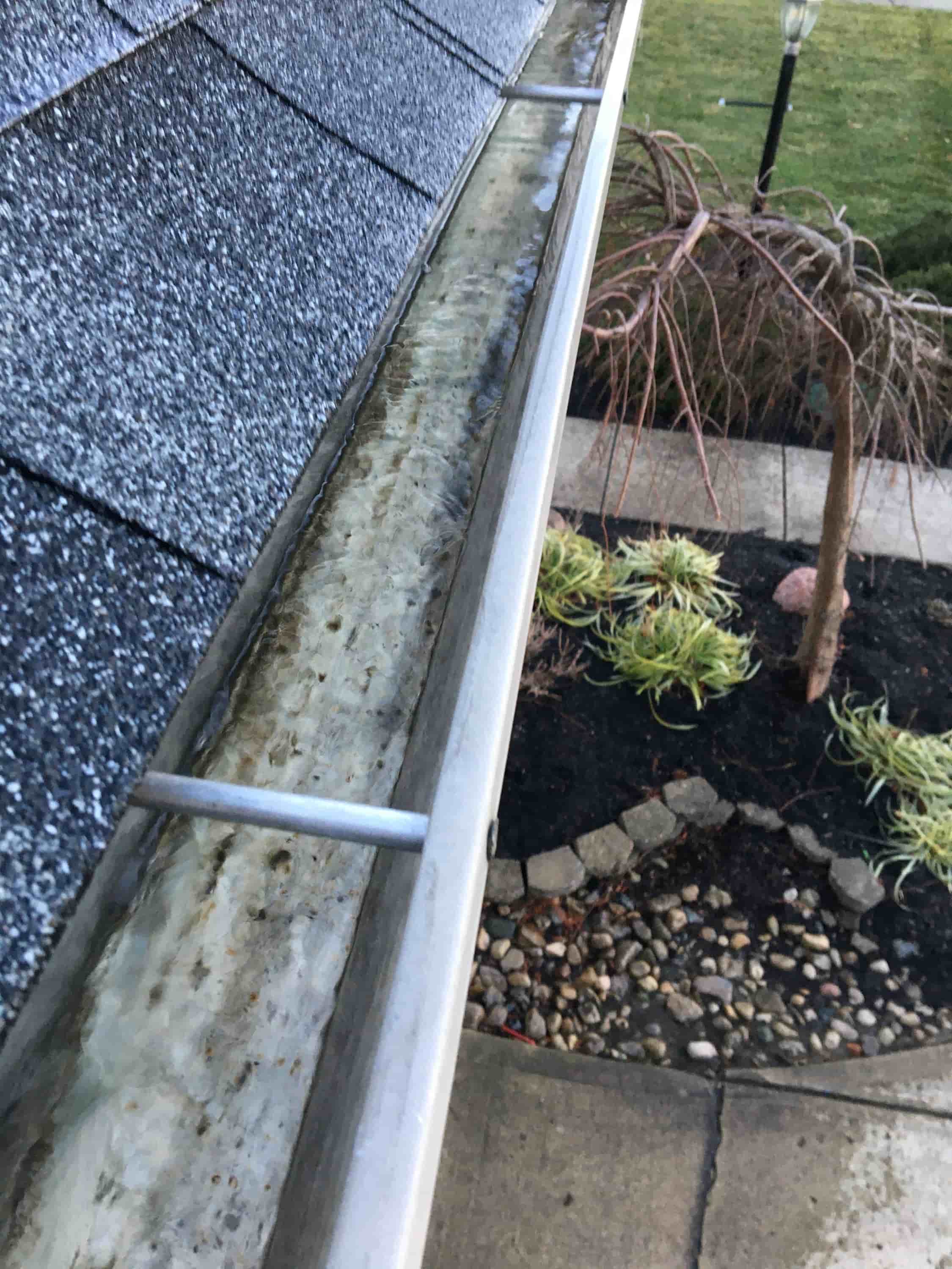 using a leaf blower to clean gutters