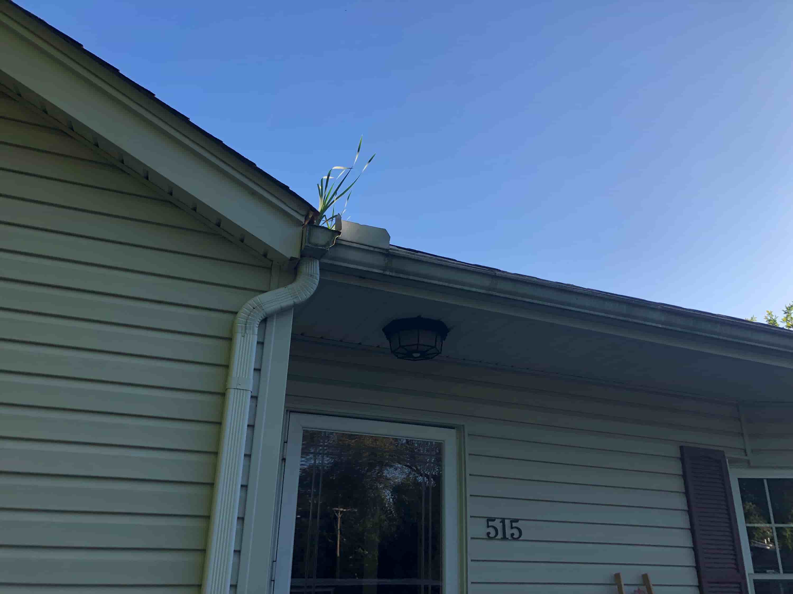 clean gutter with pressure washer