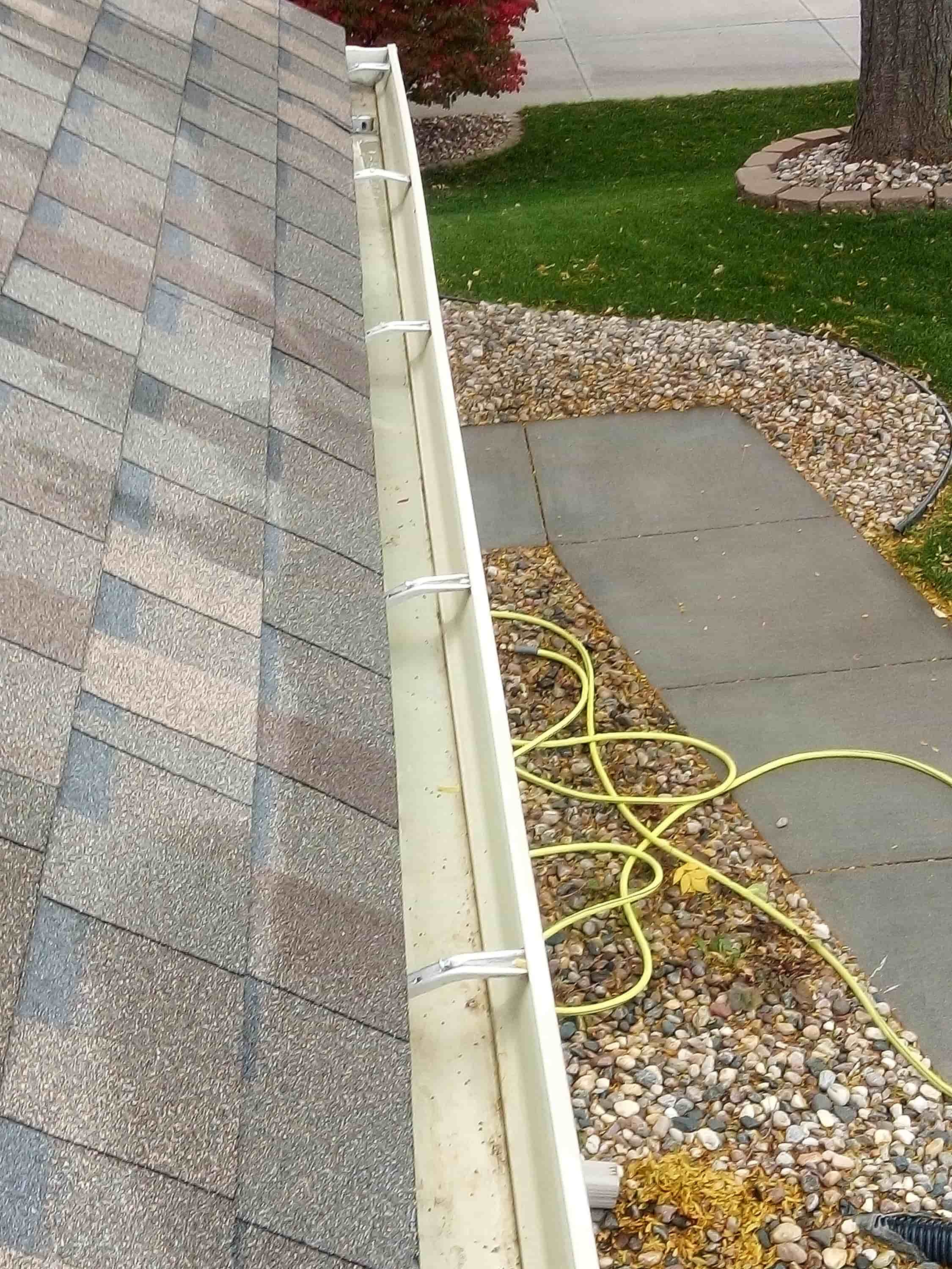 cleaning gutters above conservatory