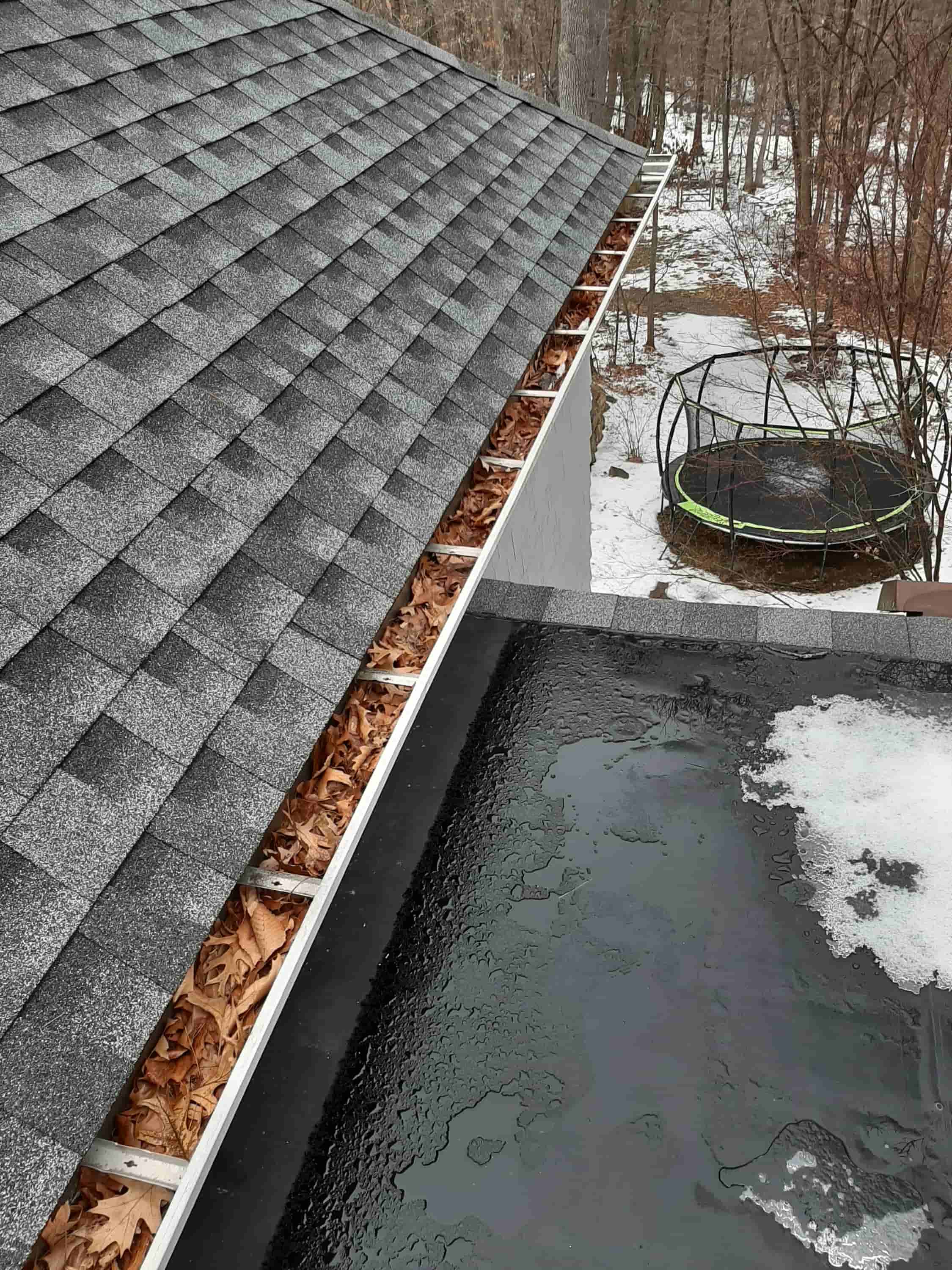 cleaning roof gutters