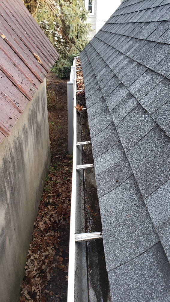 clean gutter downspout from ground
