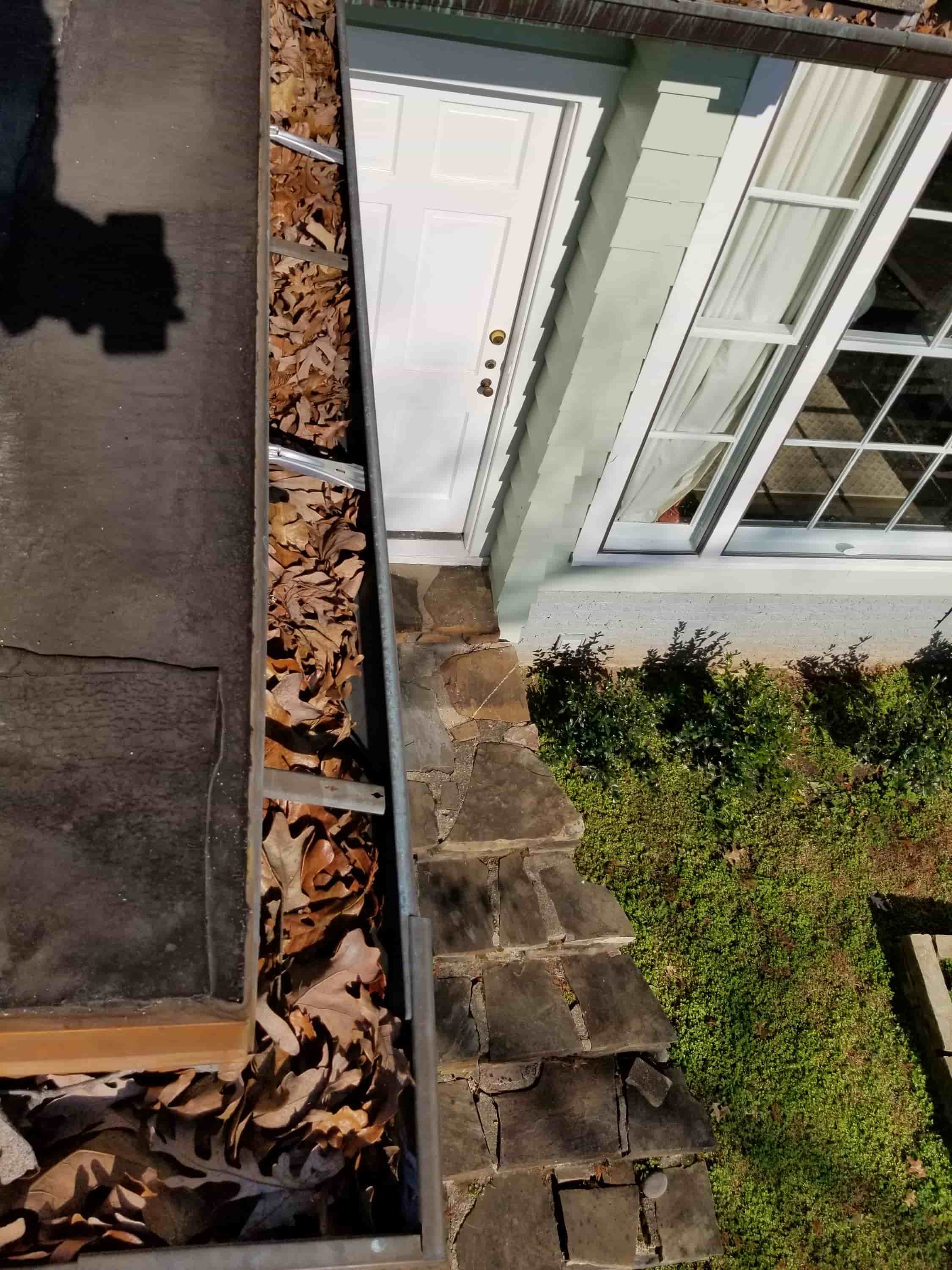 how to clean gutters with guards