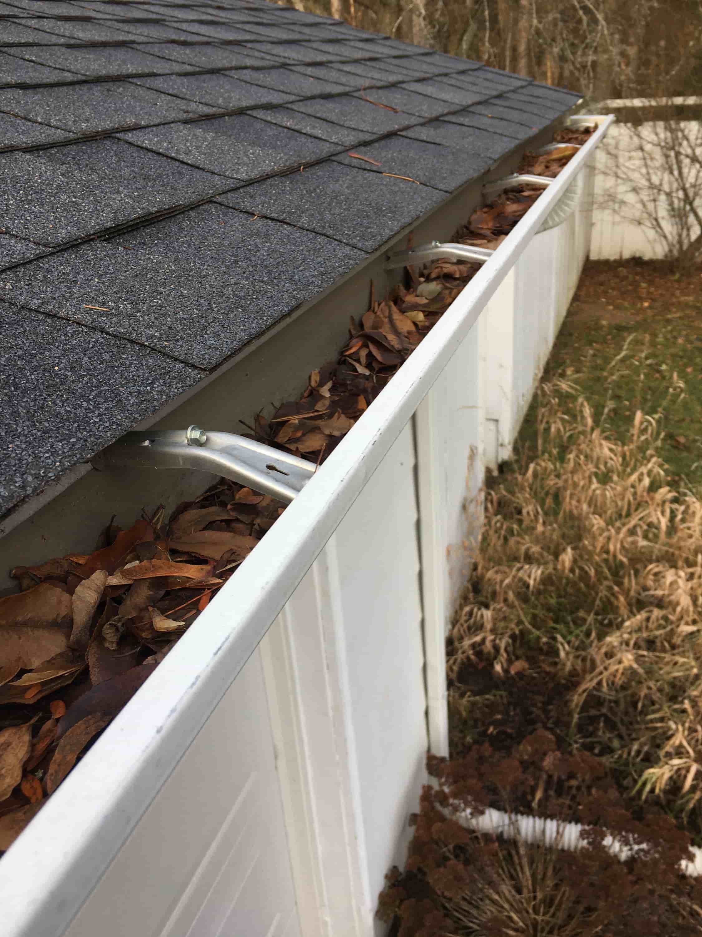 cleaning leaves from gutters