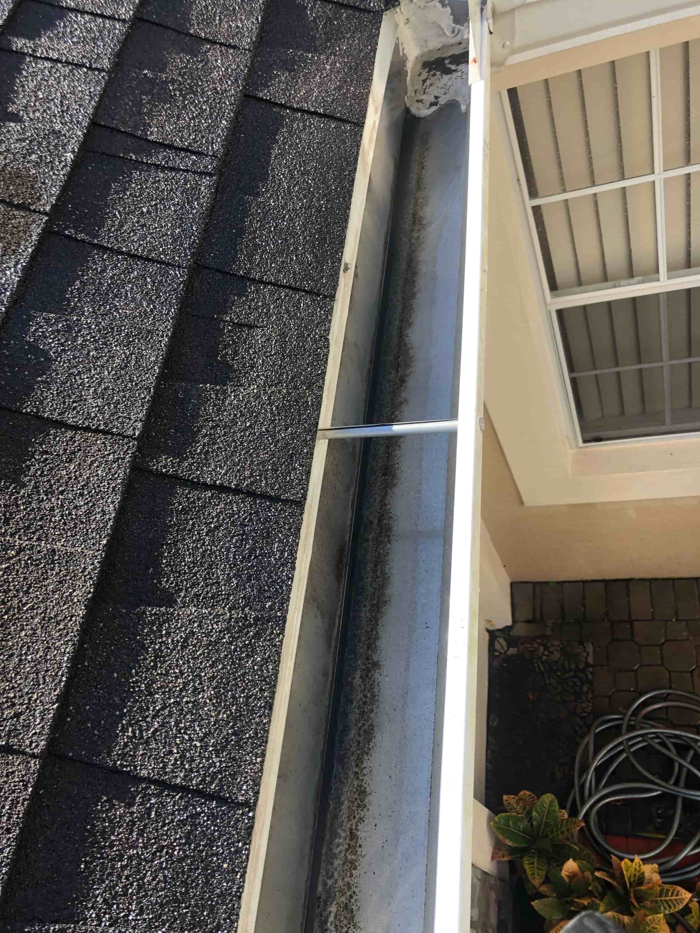 cleaning out gutter drains