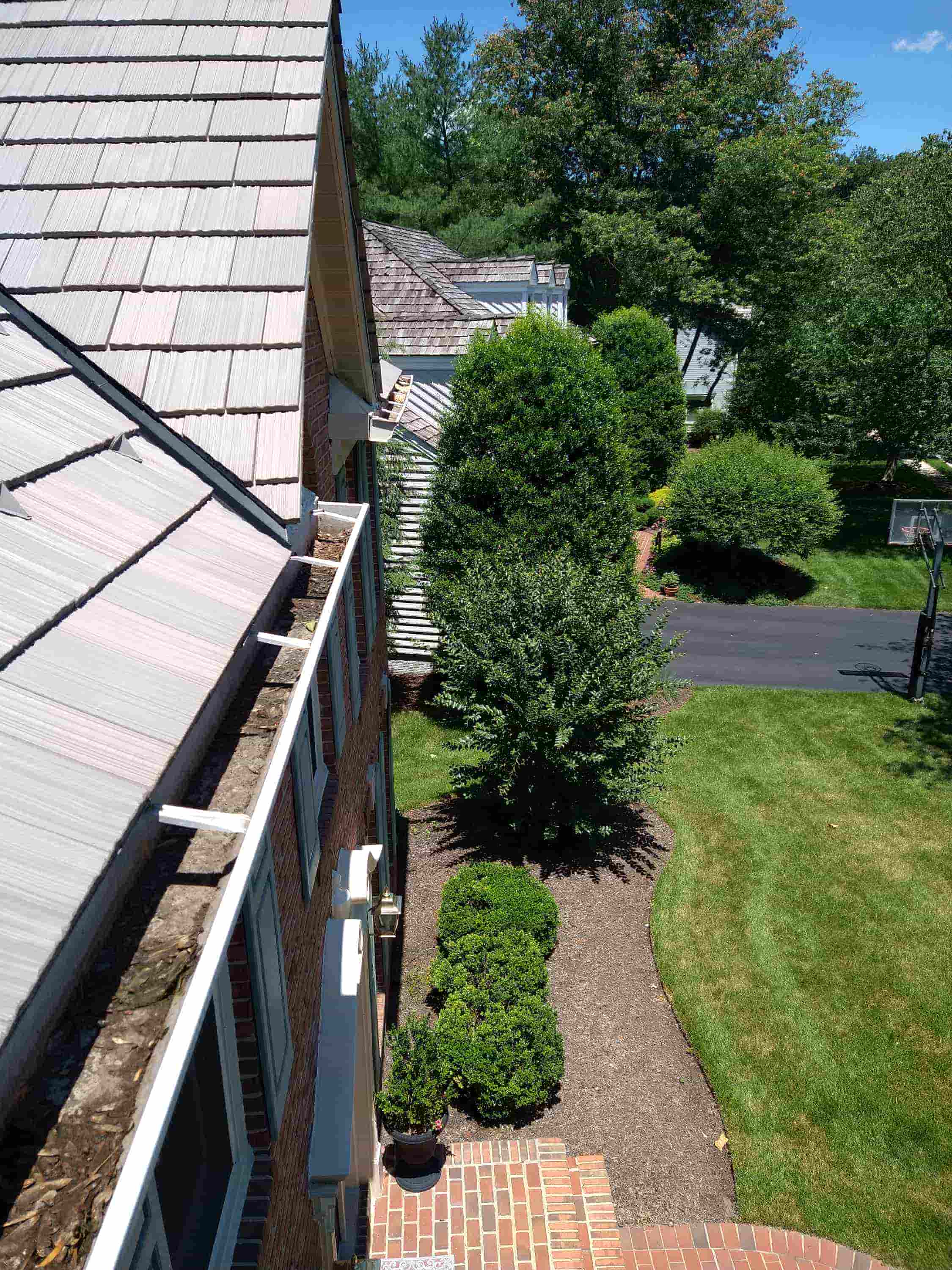 who cleans gutters