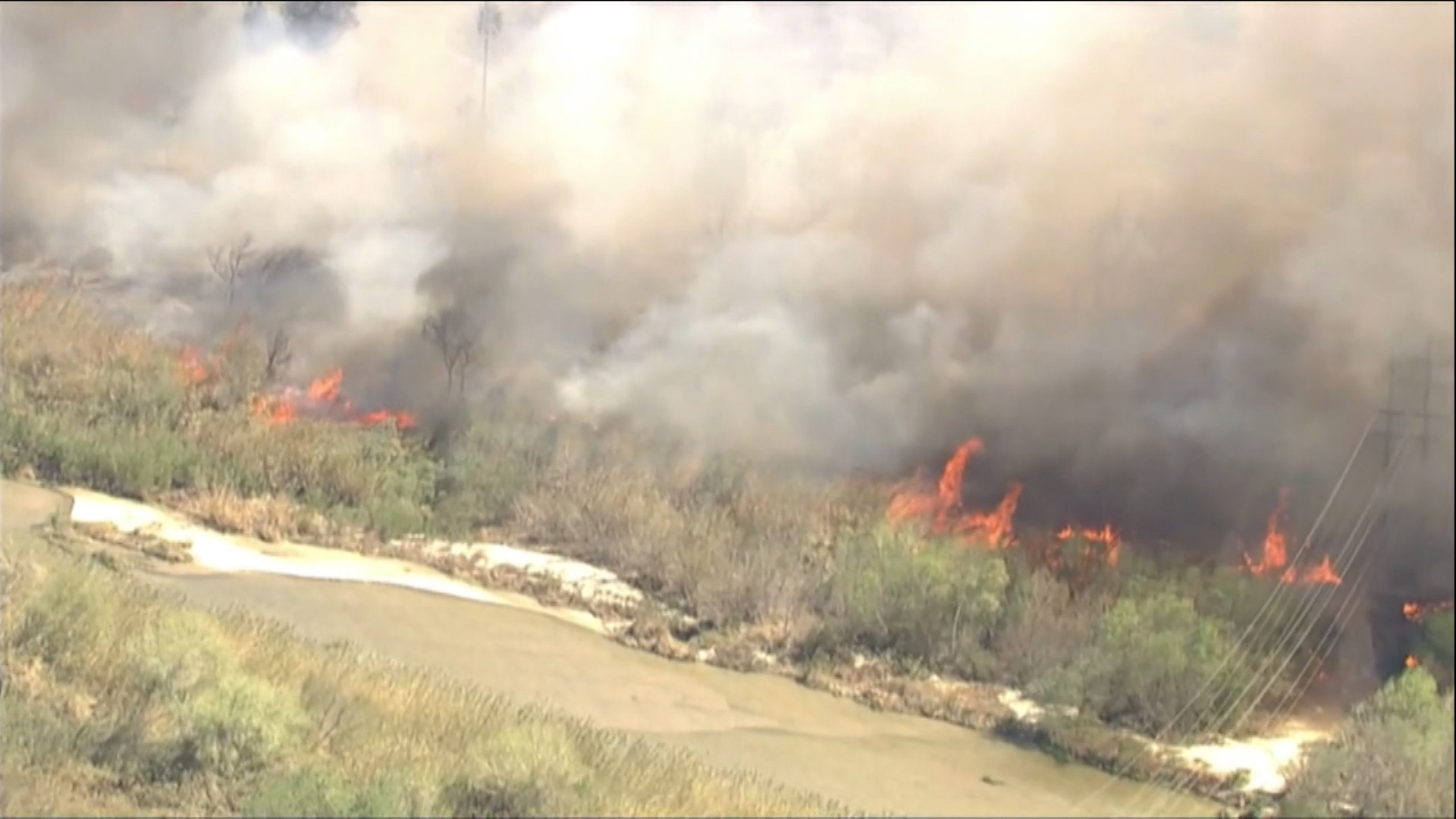 Evacuations in place after fire erupts in Santa Ana River bottom near