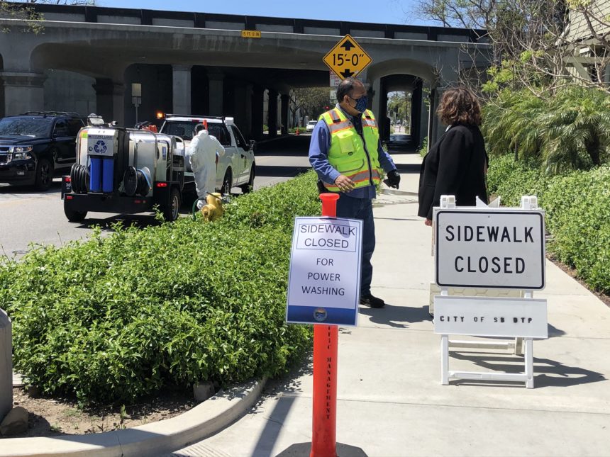 City closes sidewalk to power wash