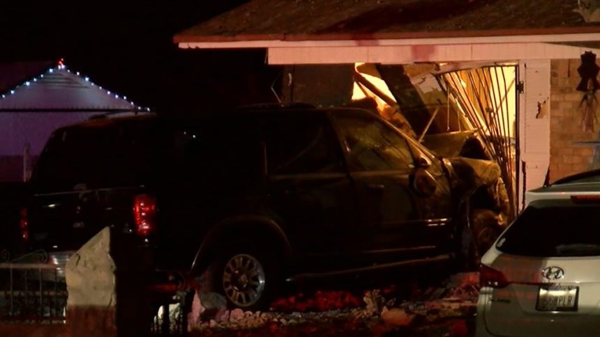 suv crashes into house