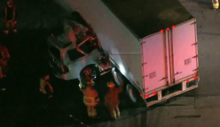 SUV under semi 2
