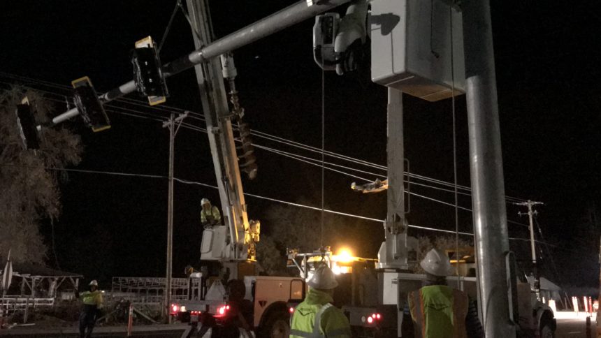 Electric crews install traffic lights at Sunnyside and Ammon Roads