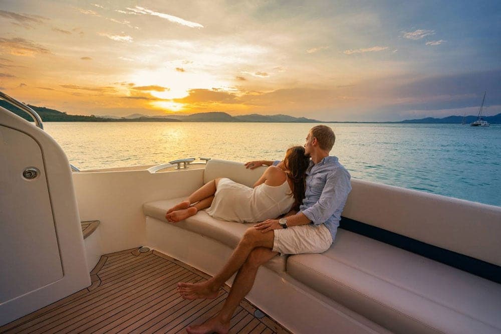 A couple watching Sunset on a luxury yacht in the Caribbean