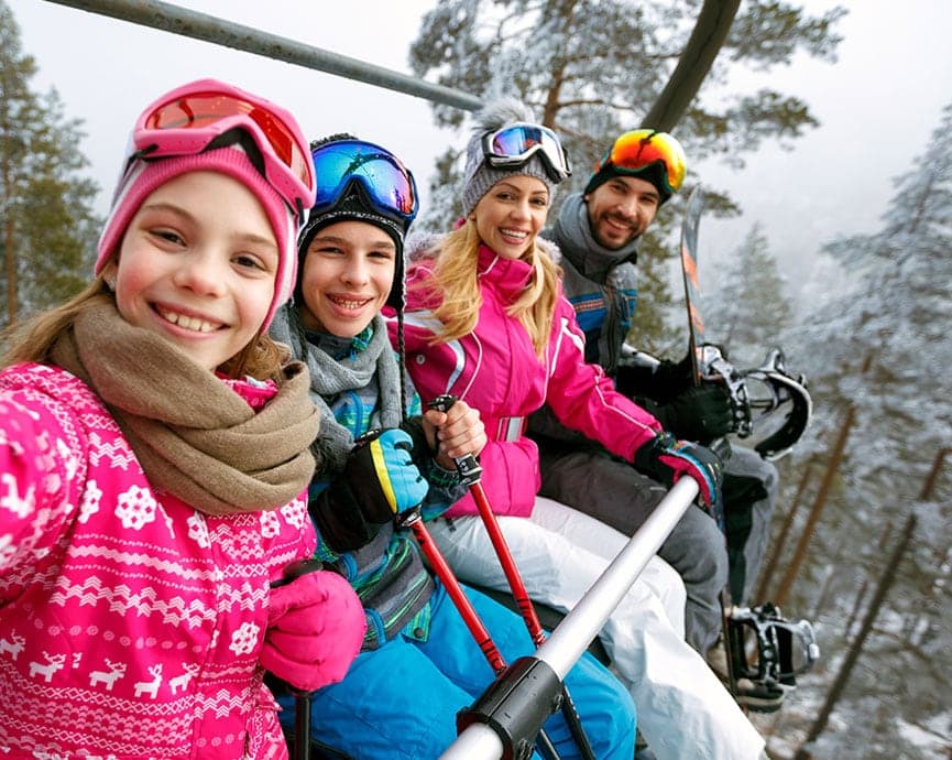 Moving Mountains guests enjoying gondola ride up to ski in Colorado