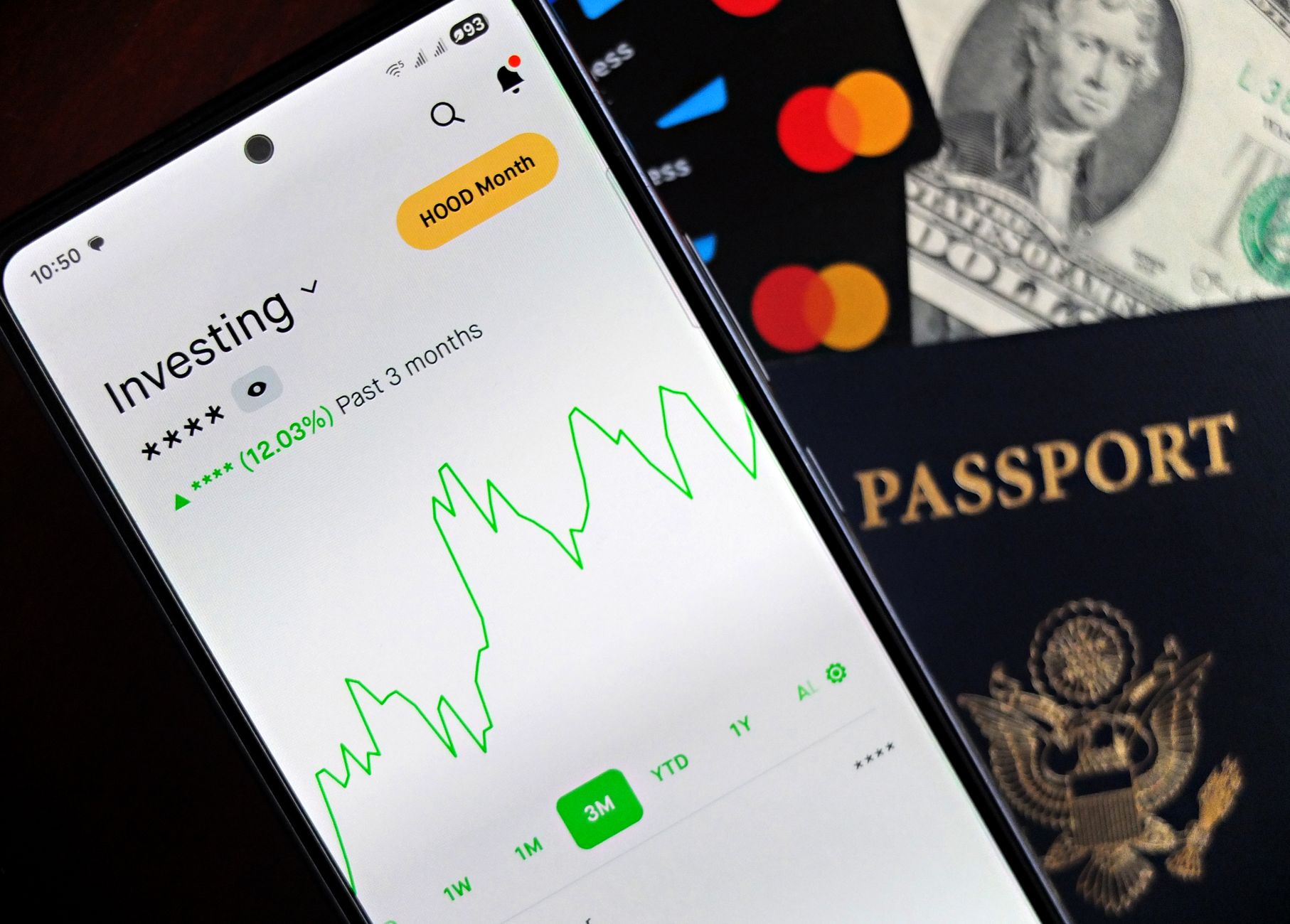 Corretora ou Banco na Compra de Dólar: Veja as Diferenças Smartphone showing stock market app with travel essentials: passport, money, and cards.
