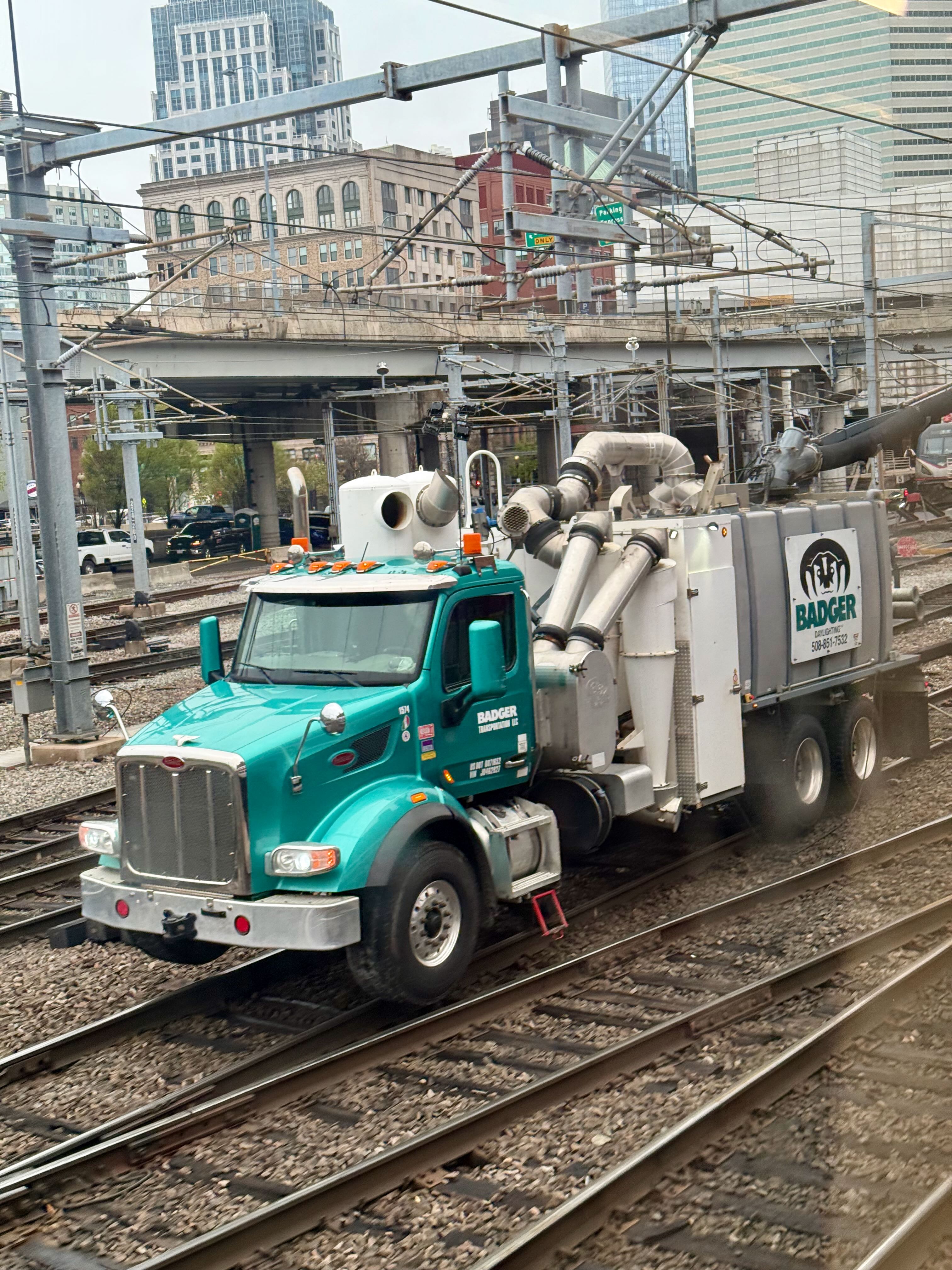 A highrail truck with many interesting pipes
