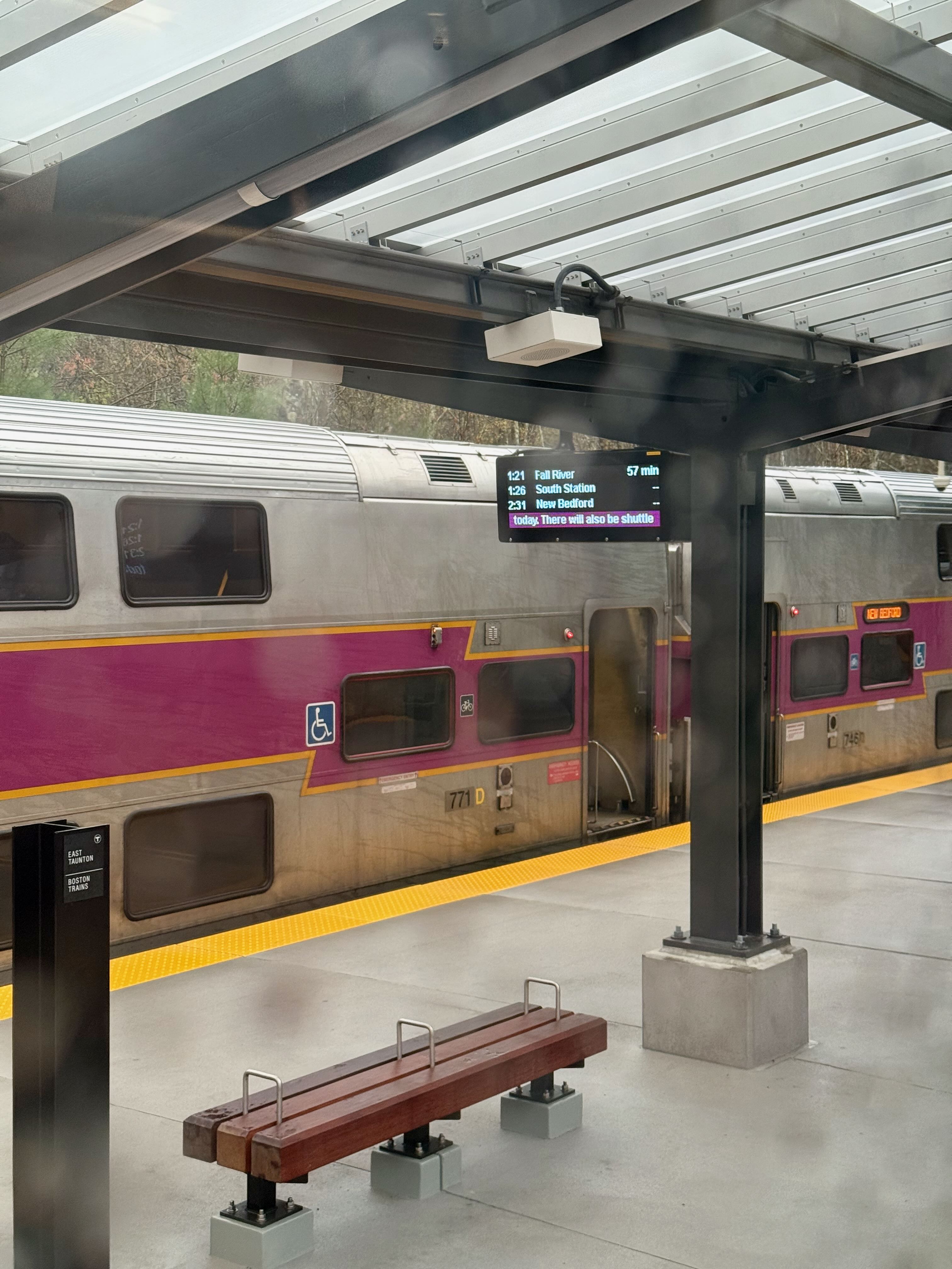A double level MBTA commuter rail coach stopped in East Taunton, MA