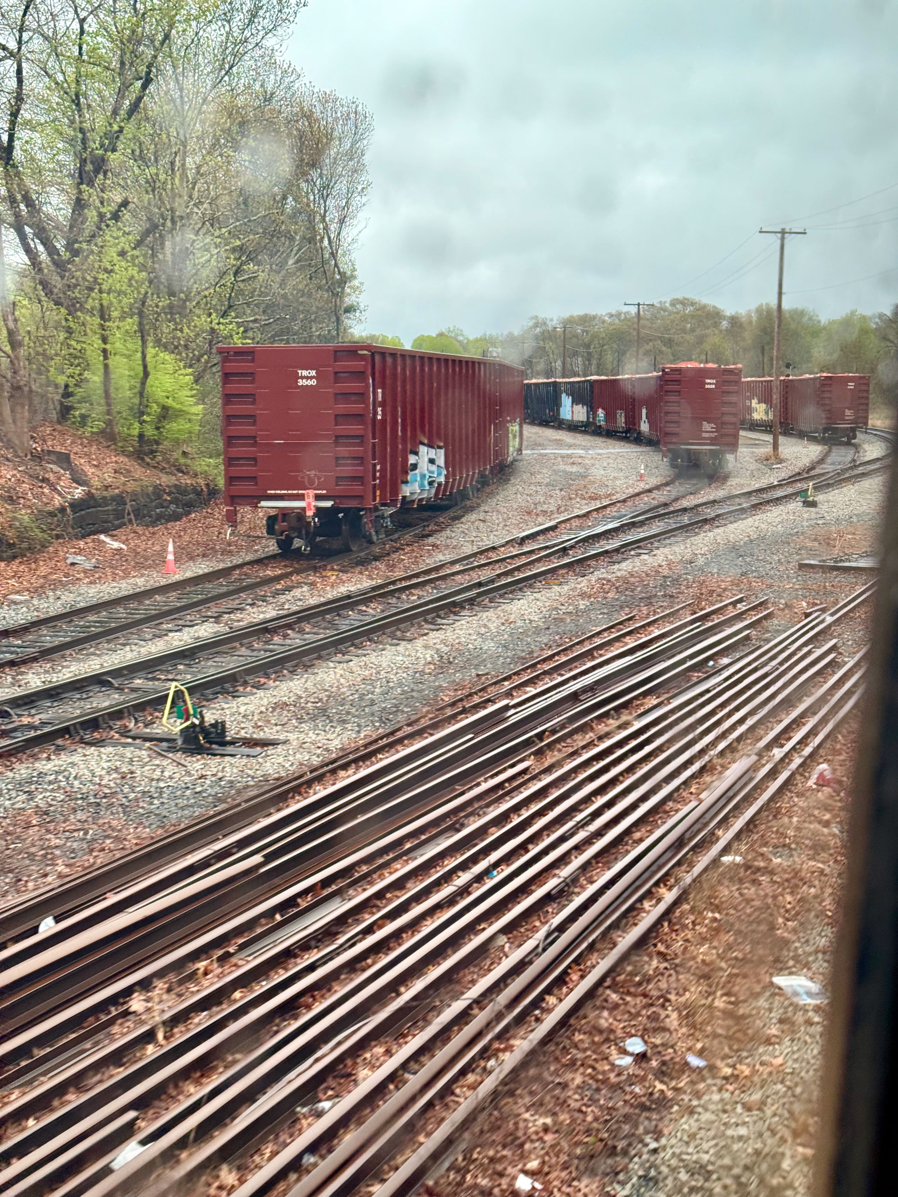 Boxcars on 3 tracks in a railyard