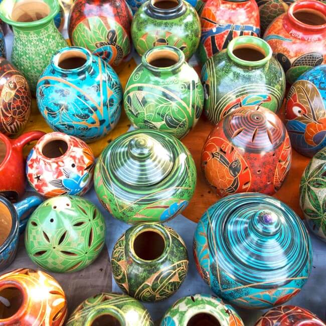 A variety of brightly colored ceramic vases and pots.